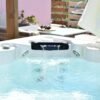 a pool with a chair and a table in the background