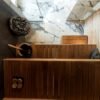 Wooden sauna benches with stones and bucket